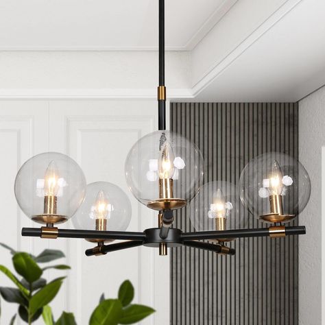 Bring a modern look to your dining room, kitchen, and beyond with this modern chandelier. Black And Brass Chandelier, Rustic Chandelier Dining Room, Industrial Hanging Lights, Dining Room Light Fixture, Black Island, Hanging Ceiling Lamps, Island Pendant Lights, Round Chandelier, Ceiling Hanging