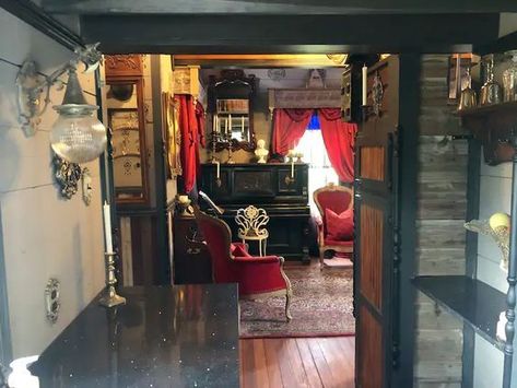 Calling the Goths! I have posted tiny houses and cottages, but never one like this. It’s a little gothic mini mansion. The... Gothic Victorian Living Room, Mini Mansion, Gothic Cottage, Custom Sliding Doors, Large Entryway, Dripping Springs Texas, Fireplace Doors, Victorian Living Room, Mansard Roof