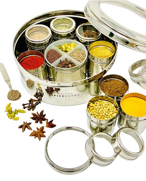 PRICES MAY VARY. Our spice box is the most convenient way to store your spices and take out spices from the container to use in daily use for cooking. Authentic and Unique Spice Box for your kitchen - This luxurious spice box contains 12 different containers with individual lid.It comes with a spoon to measure spices and a see-through individual lid for containers made out of acrylic. Our spice box is beautifully designed with high-quality stainless steel for easy handling as well as air-tight t Indian Spice Box, Masala Dabba, Gift For Chef, Spice Set, Indian Gifts, Dried Mangoes, Organic Spice, Spice Containers, Spice Box