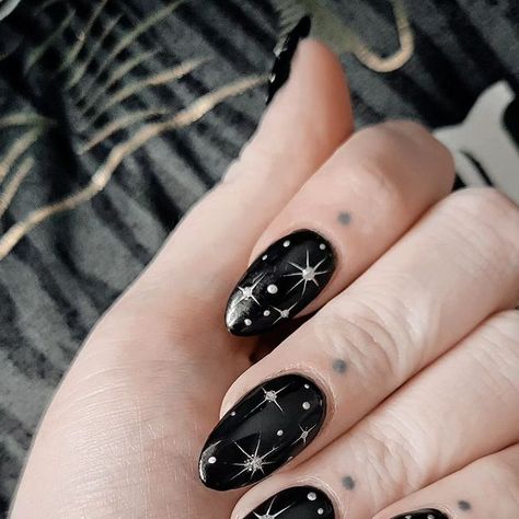 Fun Black Almond Nails, Black Sparkle Design Nails, Nail Inspo Almond New Years, Black Nail Designs Coffin Shape, Witchy Holiday Nails, Black Nails With Silver Sparkles, Minimalist Celestial Nails, Black Moon Nails Acrylic, Black With Silver Stars Nails