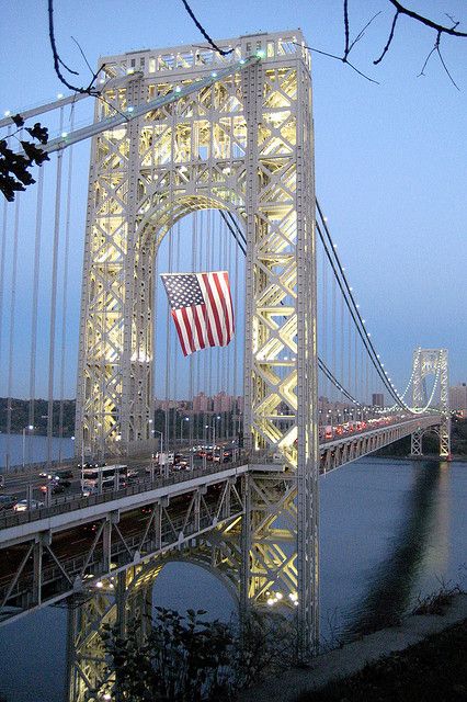 The George Washington Bridge is a 4,760-foot bridge connecting upper Manhattan’s Washington Heights to New Jersey. Completed and opened to traffic in October 1931, the suspension bridge towers 604 feet over the surface of the Hudson River below. It carries more than 106 million vehicles each year, making it the world's busiest motor vehicle bridge. In 1981, the bridge was designated as a National Historic Civil Engineering Landmark. Bridge Structure, Upper Manhattan, Usa City, Washington Heights, I Love Ny, Unique Places, Suspension Bridge, George Washington Bridge, City That Never Sleeps