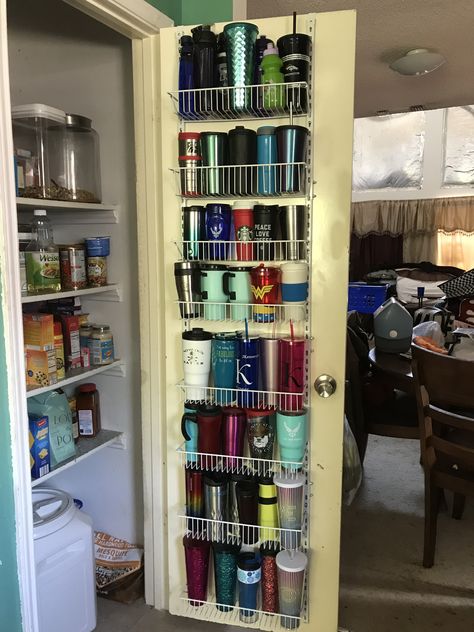 Over the door organizer used to hold tumblers, coffee cups, and water bottles. Starbucks Tumbler Organizer, Diy Cup Organizer Organization Ideas, Organisation, Over The Door Kitchen Organizer, Water Bottle Station Kitchen, Coffee Cups Organization, Organizing Starbucks Tumblers, Yeti Cup Organizer, Tumbler Cups Organization