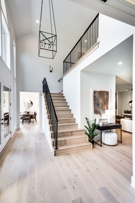 Gorgeous entryway for a transitional modern home Modern Transitional Flooring, Contemporary Traditional Home Exterior, Modern New Construction Home, Spanish Modern Staircase, Modern Entryway With Stairs, Modern House Entrance Interior Entryway, Modern But Homey House, Modern Transitional Staircase, Transitional House Design Interior