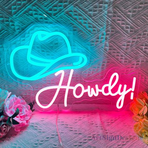 Let this "cowboy hat with howdy" neon light take you into the world of cowboys. Meticulously designed and crafted to give off a warm, inviting glow, this neon light is available in a variety of colors and sizes so you can customize it to your liking. Whether you want to decorate your own bedroom, create a fun atmosphere at a party, or add a splash of cowboy color to your workspace, our "cowboy hat howdy" neon light is perfect for you. This neon light is even a great choice for a gift for yoursel Gifts For Cowboy, Neon Western, Cowboy Art Western, Wall Decor Western, Neon Decor, Cowboy Art, Cowboy Cowgirl, Neon Light, Cowboy Hat