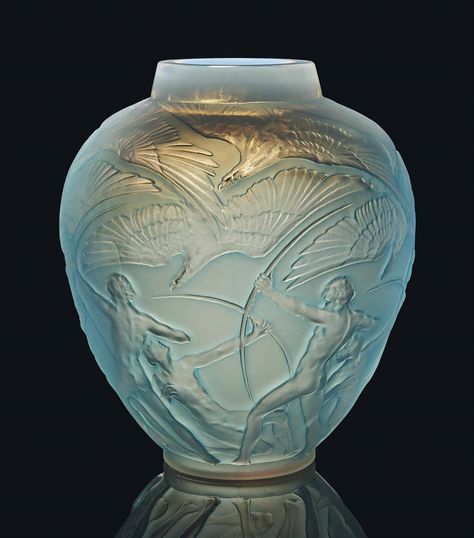 An Archers Vase, No. 893 designed 1921, cased opalescent and blue stained 10 ¾ in. (27.4 cm.) high engraved R. Lalique France No. 893 Lalique Crystal, Glass Engraving, Rene Lalique, Antique Perfume Bottles, Antique Perfume, Vintage Bottles, Vases And Vessels, Bottle Vase, Glass Perfume Bottle