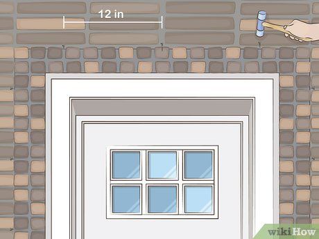 3 Easy Ways to Hang Garland Around Your Front Door - wikiHow Natal, Garland Around Door Frame Outside, Christmas Garland Doorway Front Entry, Porch Garland, Garland Hanger, French Front Doors, Outdoor Garland, Outdoor Party Lighting, Outside Christmas Decorations