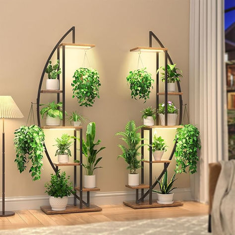 With 6 tiers, 12 pot stands, and 4 hanging hooks, this half moon plant stand offer you generous storage space for showcasing your plants to the fullest. Moreover, it can double as a display shelf for your books, pictures, collectibles, awards, small ornaments, artworks, crafts, and more. This plant stand will make for a creatively stylish addition to your home decor. #ad Tiered Plant Stand Indoor, Tall Plant Stand Indoor, Moon Plant, Plant Rack, Tall Plant, Tall Plant Stands, Furniture Straps, Grow Light Bulbs, Support Pour Plante