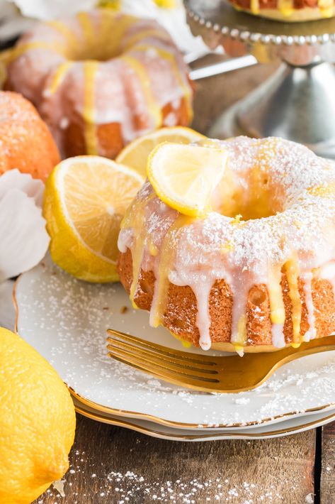 These Mini Lemon Bundt Cakes are the perfect combination of tangy and sweet! The soft and buttery cake, with bits of lemon zest, is topped with a simple and sweet lemon glaze. They are great for a fancy dessert table or as gifts. Plus, they're incredibly easy to make with basic pantry ingredients! Fancy Dessert Table, Mini Lemon Bundt Cakes Recipe, Lemon Bunt Cake, Lemon Bundt Cakes, Mini Lemon Bundt Cakes, Crockpot Peach Cobbler, Breakfast Bundt Cake, Bundt Pan Recipes, Lemon Bundt Cake Recipe