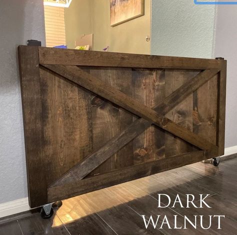 "This listing is for a 24\"x44\"x1.5\" farmhouse baby gate with all the hardware included (wheels and brackets) it's the perfect space saver to keep your babies safe from stairs, stoves, etc. If you need a custom size, message me and we'll be happy to provide a quote The color in the first picture is provincial, the color in the second picture is Ebony" Rolling Baby Gate, Diy Dog Gate, Barn Door Baby Gate, Porch Gate, Indoor Dog Gates, Diy Baby Gate, House Rules Sign, Dog Gates, Half Doors