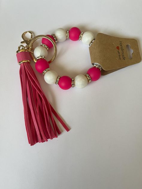 15mm pink and white silcone beads separated by crystal spacers. Each keychain does have a pink tassel and gold keychain ring with clasp. Hot Pink Bracelet, Hot Pink Bracelets, Gold Keychain, Bracelet Keychain, Keychain Ring, Pink Tassel, Pink Bracelet, Pink And White, Labour Day