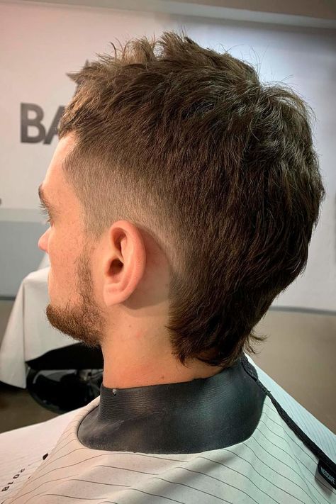 All You Need To Know About A Modern Mullet Haircut ★ Guy Mullets Curly, Men’s Haircut Mullet Fade, Modern Style Mullet Men, Modern Mullet Fade Mens, Mullet Mens Modern, Men’s Modern Mohawk, Mullet Mohawk Fade, Sporty Mullet, Updated Mullet Haircut Men