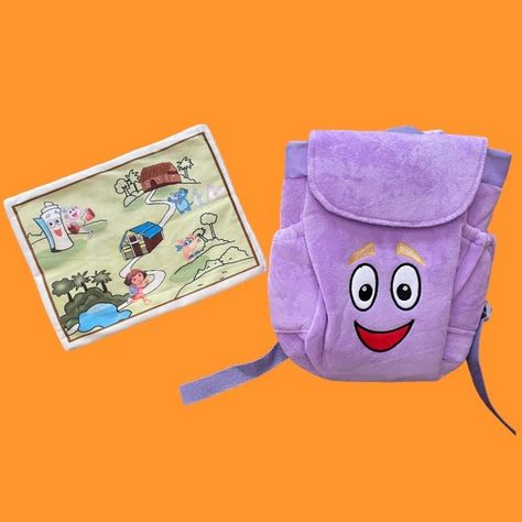 Dora The Explorer Plush Mr. Face Purple Backpack With Map New Without Tags - Still In Original Clear Bag Backpack Has Embroidered Face, Hook And Loop Closure, And Drawstring Top Plush Map Rolls And Tucks Into Side Pocket Of Backpack Measures Approx 9" X 8" X 4" - Small Size Is Perfect For Pretend Play Or Costume Accessory Spiderman Backpack, Kids Purse, Uniqlo Bags, Embroidered Face, Purple Backpack, Plush Backpack, Metallic Purse, Drawstring Top, Dora The Explorer