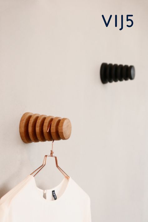 Alf is a wall hook adapted to accommodate up to five clothes hangers at the same time. The hook of each standard hanger fits perfectly into the cut-out grooves that separate the hangers neatly from each other at the same time. Ideal for airing clothes, for example, or for hanging them ready for the next day. Design by Gustav Rosén. #Hook #Alf #Vij5 #Wood #Clotheshook #Practical #Consciously #Swedisch #Nordic #Design #Spacesaving #Wallhook #Hanger #Oak #Black Small Wood Projects, Wall Hangers For Clothes, Air Clothes, Camper Curtains, Dye Ideas, Hanger Design, Clothes Hooks, Hook Design, Clothes Hangers