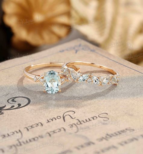 Oval Aquamarine Engagement Ring Set, Vintage Aquamarine Ring Rose Gold, Dainty Marquise Ring, Unique Aquamarine Ring Set Ring#:NC16280/NC16289 Engagement Ring Center stone: Aquamarine oval cut 6*8mm Side stones: Moissanite round cut 1.2mm Wedding Band Stones :Aquamarine Size/weight :Marquise cut 2*4mm Custom orders are most welcome! Please feel free to ask for any item, any adjustments or anything else you want me to make. Rush order Orders can be expedited for a fee. If your order needs to be e Aquamarine Engagement Ring Dainty, Engagement Ring With Aquamarine Accents, Wedding Rings With Aquamarine, Vintage Wedding And Engagement Ring Set, Vintage Engagement Rings Aquamarine, Aquamarine And Gold Engagement Ring, Aquamarine Engagement Ring Gold Band, Rose Gold Aquamarine Engagement Ring, Aquamarine Rose Gold Ring