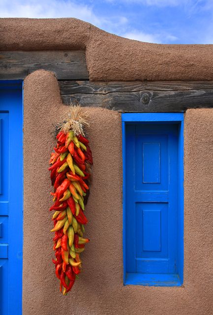 Chile ristras are common decorations around doors and windows on homes in New Mexico  #KlausPriebe Chile Ristra, Southwestern Landscape, Southwest Living, New Mexico Style, New Mexico Homes, Taos New Mexico, Mexico Style, Adobe House, Santa Fe Style