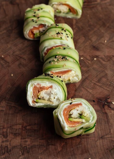 Cucumber Wrapped Sushi Roll — saltnpepperhere Sushi Recipes Cucumber Roll, Cucumber Wrapped Sushi Rolls, Homemade Cucumber Sushi Rolls, Teriyaki Chicken Cucumber Sushi, Lettuce Sushi Rolls, Sushi Meal Ideas, Cucumber Salmon Sushi Rolls, Sushi Cucumber Roll, Cucumber Meal Ideas