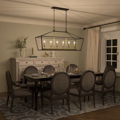 Illuminate your dining table or kitchen island in farmhouse flair with this 6-light linear chandelier. Crafted from metal, the fixture features a rectangular shape with an arched top and an open construction for an airy feel. We love that its luminous finish makes it easy to coordinate with your aesthetic. Inside the frame, six candle-style sconces suit 60W candelabra bulbs (sold separately). Up top, it hangs from two height-adjustable downrods and a canopy that works with sloped ceilings. We lo Black Rectangular Chandelier, Farmhouse Dining Room Lights Over Table, Farmhouse Dining Room Light, Chandeliers Kitchen, Black Modern Farmhouse, Dining Table Chandelier, Dining Table Light, Chandelier Kitchen, Modern Farmhouse Lighting