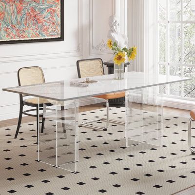 With its clean lines and contours, this contemporary dining table has a contemporary look and can accommodate up to six guests. It has a rectangular stone top, so accidental spills are easily wiped away. The unique acrylic stand design makes it more like floating in the restaurant. And this structure gives the table plenty of support, so your dining room feels light and airy when guests are enjoying brunch or holiday dinner. | Orren Ellis Yaretsy Rectangular Sintered Stone Dining Table Plastic / Sintered Stone Dining Table, 1st Apartment, Stone Dining Table, Contemporary Dining Table, Acrylic Stand, Sintered Stone, Contemporary Dining, Stone Top, Rectangular Dining Table