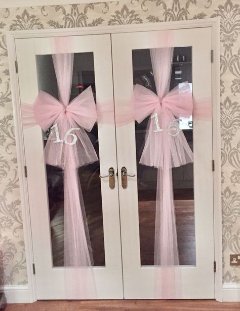 Baby pink door bows created for 16th birthday. Pink netting used to create the bows Simple Pink Party Decorations, Pink And Blue First Birthday Party, White And Pink Theme Party, Pink Bow Birthday Party Decorations, Baby Shower Light Pink, Pink And Pearls Birthday Party, Pink Fairy Party, Sweet 16 Light Pink Theme, Pink And Pearl Bridal Shower Ideas