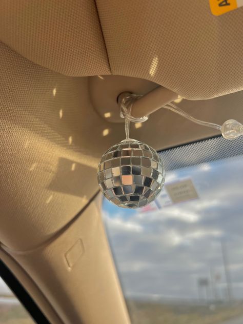 Car Decor Backseat, Aesthetic Cars Inside, Girl Car Aesthetic Interior, List Of Car Essentials, Dashboard Car Aesthetic, Disco Ball In Car, Cute Car Gadgets, Inside Cars Aesthetic, Dream Car Decor