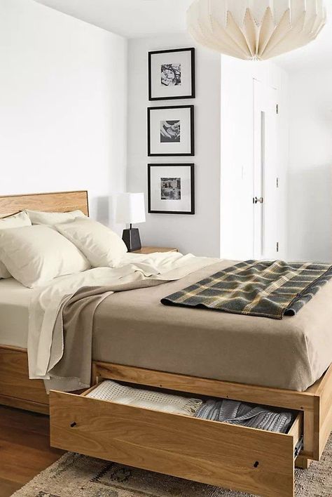 Discover the best storage beds to buy now for an organized and streamlined space. From elevated beds to pull-out drawers, rest easy knowing your items are out of sight. A bed with hidden storage is the perfect solution for small bedrooms and cramped studio apartments.#bedroomdecorideas #homedecorideas #cozybedding #marthastewart Bed Bases, Bed Frame Design, Wooden Bed Design, Bed Design Modern, Bed Storage Drawers, Bed Furniture Design, Bedroom Bed Design, Bed Frame With Storage, Modern Bedroom Furniture