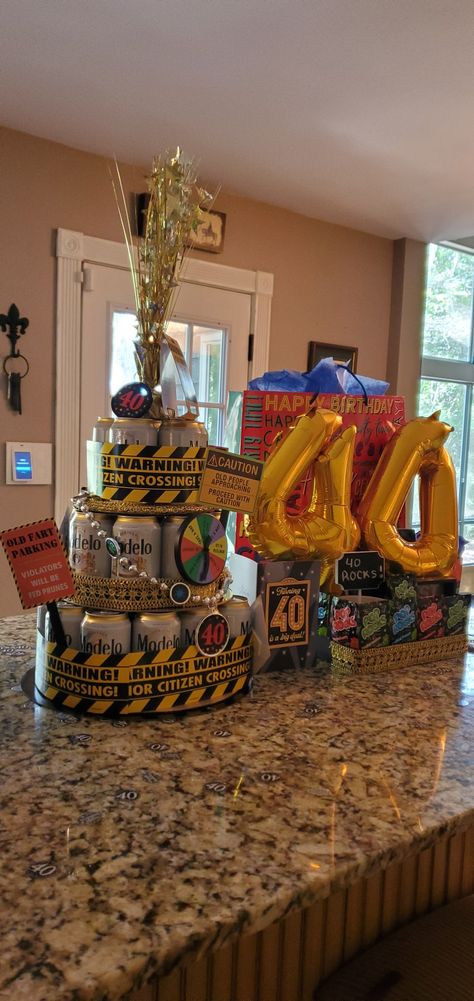 40th birthday diy beer can cake 40 Year Old Cake For Men, 40th Birthday Beer Cake, 40th Bday Cakes For Men, Beer Cakes For Men, Diy Beer Cake, Beer Cake Tower, Birthday Cake Beer, Beer Can Cake, 40th Birthday Cakes For Men