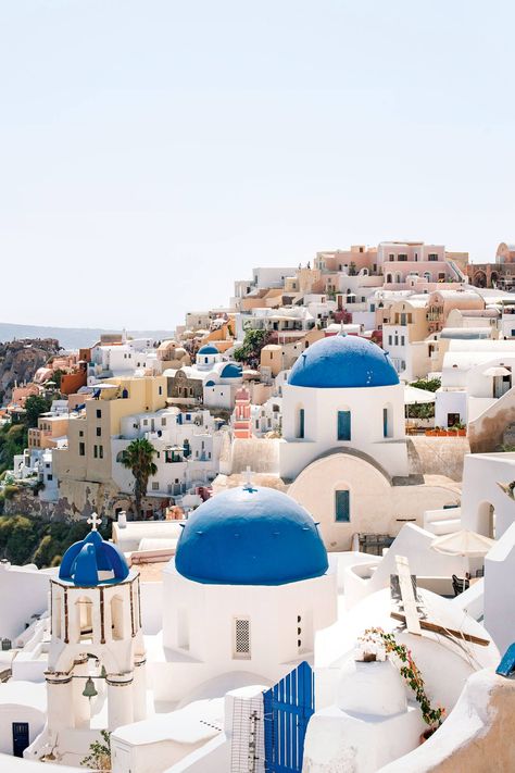 It's the most classic of all the classic Greek towns. Santorini's cliff-hugging Oia is the sweetest spot on the island. The white-washed buildings are scattered with blue dome churches, and secret lanes lead off the busy main thoroughfares to uninterrupted views of the sea. Evenings get busy with those seeking Santorini's famous sunsets – visit early to get the town to yourself. Greek Buildings, Hillside Villas, Greek Village, Greek Town, Greek Sea, Best Greek Islands, Building Aesthetic, Greece Summer, Greek Villas