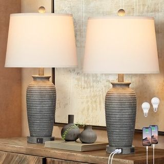 This product is set of 2 table lamps. The lamp body is made of gray-white resin. And its interface is designed with the style of layer upon layer of waves. Its overall styling is used for reference of stean. Because the table lamp is used during the night with high frequency, we want our design can be closer to life. Its shade is tilted and knockdown. It's easier to replace and clean. Rustic Bedside Lamps, Bedside Lamps With Usb, Bedroom Lamps Nightstand, Nightstand Lamps, Farmhouse Table Lamps, Jar Table Lamp, Table Lamps Living Room, Side Tables Bedroom, Bedside Lamps