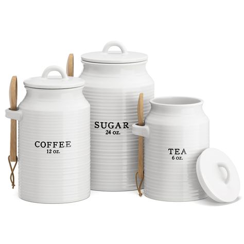 PRICES MAY VARY. Ceramic Kitchen Canister Set w/ Scoop - Our canister sets for kitchen counter are great for holding coffee, sugar, tea or even flour. This stylish set of 3 ceramic kitchen canisters are printed with a rustic text that evokes a vintage charm. Airtight and Food Safe - The airtight kitchen canisters for countertop come with silicone lined lids and wooden spoons. Their solid design will keep the contents fresh and dry. The tea, coffee, sugar canister set is great for storing cookies Canister Sets For Kitchen, Decorative Kitchen Canisters, White Canister Set, Ceramic Kitchen Canister Sets, Tea Coffee Sugar Jars, Farmhouse Canisters, Ceramic Kitchen Canisters, Ceramic Canister Set, White Canisters