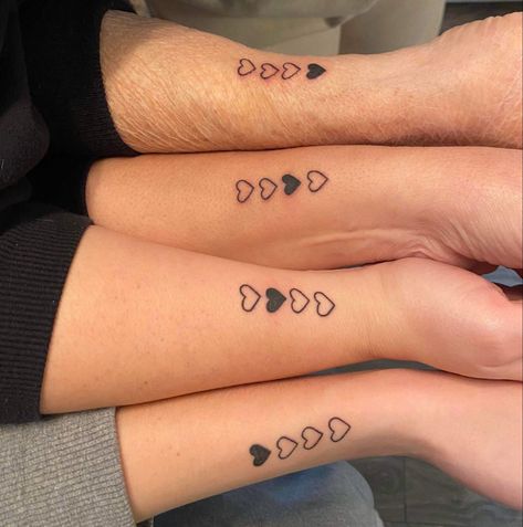Family is a powerful force in anyone’s life - it shapes us, gives love and support, and a strong sense of belonging. And what better way to celebrate these unbreakable bonds than to get a family tattoo? Triple Sister Tattoo, Family Inspo Tattoo, Family Tattoos 4 People, Small Matching Tattoos For 4 People, Four Person Tattoo, Tattoo Ideas For Four People, Tattoos For Siblings Of Four, Matching Tattoo Ideas For Family, Generational Tattoos