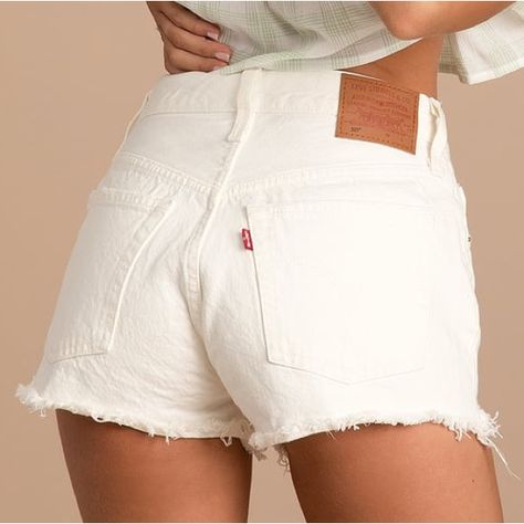 Make Your Summer Style Stand Out With The Levi's 501 White High Rise Cutoff Denim Shorts! Sturdy White Denim (In Levi's Keep It Clean Wash) Shapes These Shorts That Have A High-Waisted Fit With Belt Loops And A Five-Pocket Cut. The Silhouette Is Fitted Through The Hips And Thighs And Ends With Distressed, Raw-Cut Hems. Branded Top Button And Hidden Zipper Fly. Brown Leather Logo Patch And Iconic Red Logo Tag At Back. Unlined. 100% Cotton. Outfits With White Shorts, White Jean Shorts Outfit, White Denim Shorts Outfit, College Wishlist, White Shorts Outfit, Denim Shorts Outfit, Keep It Clean, White Jean Shorts, White Denim Shorts