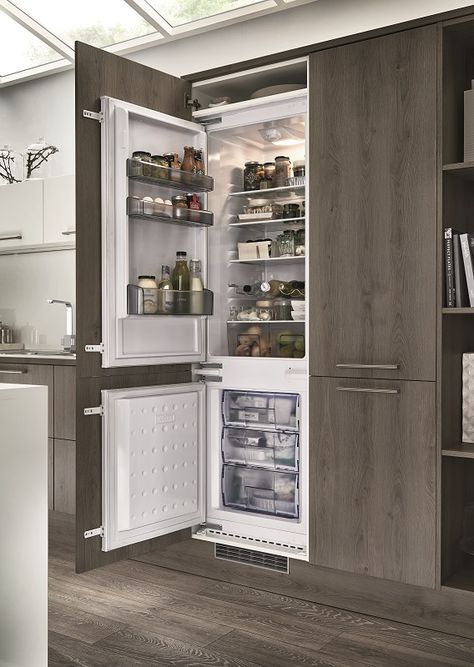 The Lamona integrated fridge freezer looking stylish in the Greenwich Dark Grey Oak Kitchen from the Universal Collection by Howdens Joinery. Visit our website to find out more. Grey Fridge Kitchen, Kitchen Integrated Fridge, Inbuilt Refrigerator In Kitchen, Huge Fridge And Freezer, Modern Kitchen Fridge Cabinet, Kitchen Ideas With Fridge, Integrated Kitchen Design, Fridge With Panels, Inbuilt Fridge Kitchen