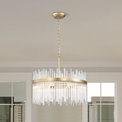 This 5-light chandelier features a striking silhouette that fills any living room or dining area with glam style. The fixture and corresponding ring are made from metal with a shiny bronze finish for an extra bit of shine. Transparent glass bars line the interior of the ring in a staggered pattern to create a stylized cylindrical shape. Five dimmable bulbs, sold separately, bring helpful illumination to your space all throughout the day. This chandelier hangs with the help of a height-adjustable 20 Foot Ceiling Chandelier, Breakfast Table Chandelier, Bedroom Chandelier Low Ceiling, Office Chandelier Ideas, Breakfast Nook Chandelier, Bright Chandelier, Dining Room Chandelier Ideas, Mercury Glass Chandelier, Large Chandelier High Ceilings