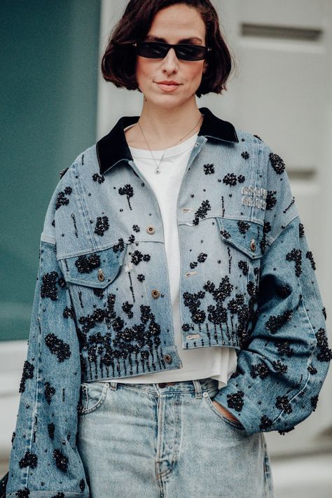 Street style at London Fashion Week Fall 2024 Upcycling, Prada Embroidery, Upcycle Jacket, Activewear Photoshoot, Fashion Illustration Face, Fashion Week Dresses, Studded Denim Jacket, Denim Pattern, London Fashion Week Street Style