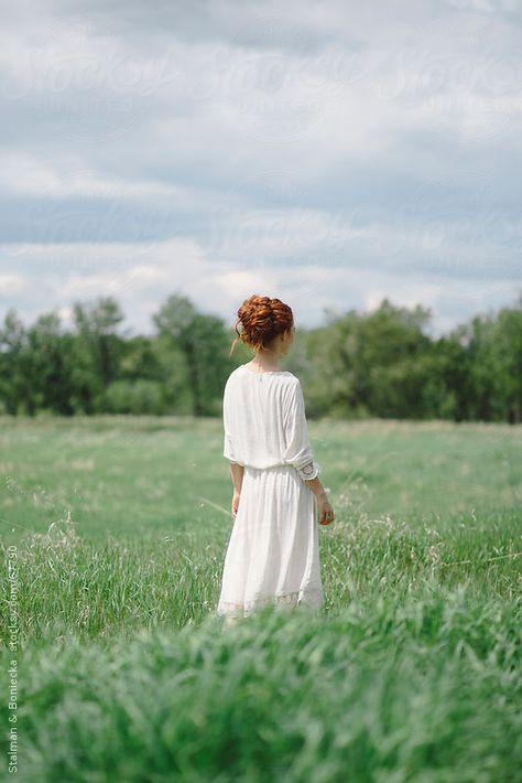 Beautiful young redhead  woman standing in a field in a white dress by Stalman & Boniecka Dress In Field Photoshoot, White Dress In Field, Woman In Field, Woman In A Field, Woman In White Dress, Standing In A Field, Young Redhead, Redhead Woman, Country Woman