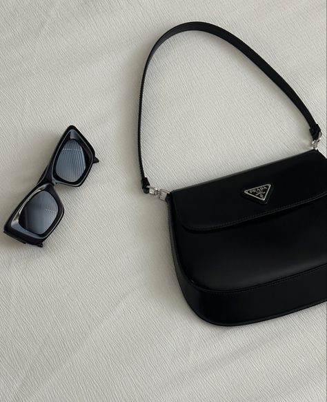 Black Prada cleo flap handbag with black Prada sunglasses on white bedsheet. Prada Cleo Flap, Prada Sunglasses Outfit, Sunglasses Minimalist, Cleo Bag, Black Bag Outfit, Faceless Content, Prada Cleo, Prada Glasses, Sunglasses Outfit