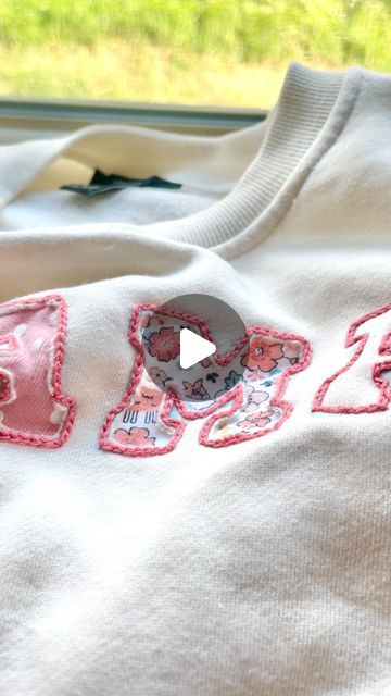 Stitchin With Samantha | Embroidery Patterns & Kits on Instagram: "Using Olive’s old newborn onesies to make a MAMA sweatshirt 🪡✨ 

I am obsessed with how this turned out and I can’t wait to wear it all the time as a keepsake for her earliest days!🥹

I have been wanting to make a onesie sweatshirt for a year now, but I was too scared to make it with a sewing machine. I was inspired by @flynn_and_mabel to try out reverse appliqué and this technique was perfect for this project!!" Diy Mama Sweatshirt, Diy Applique Sweatshirt, Reverse Applique Sweatshirt, Applique Sweatshirt Diy, Diy Shirt Embroidery, Baby Onsie Ideas, Embroidery Sweatshirt Diy, Onesie Embroidery, Newborn Embroidery