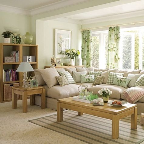 Look at this pastel green inspired living room. The color combination makes the room look airy and bright. It only has simple furnishings but it strikes you as a very pretty home all because of a well balanced color planning. Family Living Room Design, Furnitur Ruang Keluarga, Brown Living Room Decor, Cozy Family Rooms, Small Family Room, Muebles Living, Trendy Living Rooms, Living Room Green, Brown Living Room
