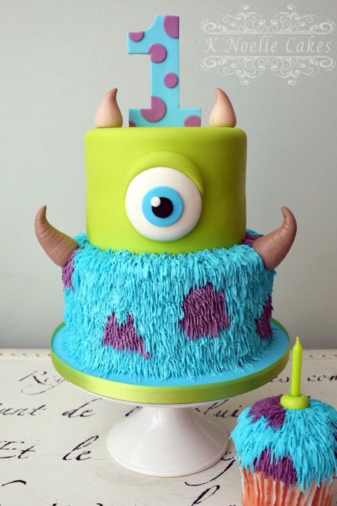 Monster Inc. cake by K Noelle Cakes Sully Birthday Cake, Monsters Ink 1st Birthday, Scared Of The Month Monsters Inc, Monsters University Birthday Cake, Monsters Inc 1st Birthday Party Ideas, Monster Ink First Birthday, Diy Monsters Inc Cake, Monsters Ink First Birthday, Monster Inc Bday Party