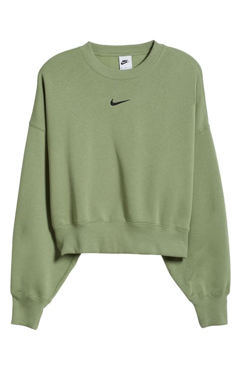 An embroidered Swoosh adds minimal branding to this cozy fleece sweatshirt cut for a relaxed, oversized fit that's enhanced by the dropped shoulders. 22" length (size Medium) Crewneck 80% cotton, 20% polyester Machine wash, tumble dry Imported Nike Sweatshirts Green, Nike Women Hoodie Sweatshirts, Womens Nike Hoodie, Cute Sweatshirts For Teens, Nike Womens Sweatshirt, Olive Green Outfits, Green Nike Sweatshirt, Crew Neck Sweatshirt Outfit, Nike Hoodie Women