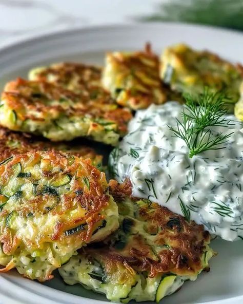 Zucchini, Feta, and Spinach Fritters with Garlic Tzatziki Zucchini Spinach Feta Fritters, Zucchini Feta And Spinach Fritters, Feta Spinach Recipes, Zucchini Ribbon Skewers, Zucchini And Feta Fritters, Vegetable Dense Recipes, Vegetable Dense Meals, Zucchini Feta Fritters, Spinach Feta Recipes