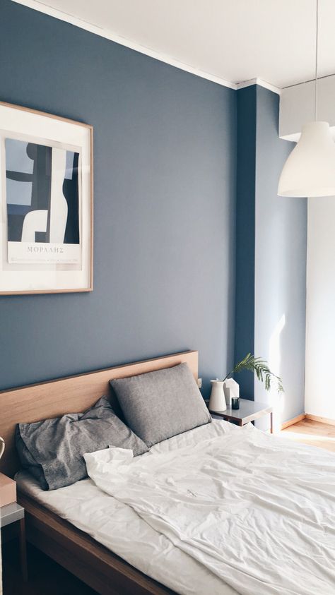 Minimalist bedroom with blue grey wall and moralis painting hanging on the wall. Bedroom Paint Blue Grey, Room Color Combination Blue, Minimalist Bedroom Blue Walls, Minimalist Wall Paint Color, Minimalist Bedroom Painting, Modern House Paint Interior Wall Colors Bedroom, Bedroom Blue Grey Walls, Wall Paint For Small Bedroom, One Blue Wall Bedroom