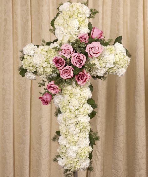 A beautiful display of pink Equadorian roses on a white 30" tall cross, presented on a 48" easle.  PINK ROSE White Carnations, Church Flower Arrangements, Funeral Service, Church Flowers, Carnation Flower, The Funeral, Sympathy Flowers, Being Held, White Cross