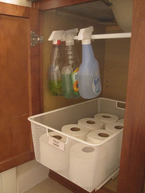 Make the most of your small bathroom in your home or apartment with these tiny bathroom hacks. See how to add more storage and organization and free up space in your bathroom cabinets. Our ideas include hanging a rod to store your cleaning products below your sink, hanging baskets on the wall to store bulky towels and using adhesive hooks to store your curling iron and flat iron. Dollar Store Organization, Diy Bathroom Storage Ideas, Organizing And Cleaning, Organized Bathroom, Bathroom Organization Hacks, Cheap Organization, Apartment Hacks, Bathroom Hacks, Camper Storage