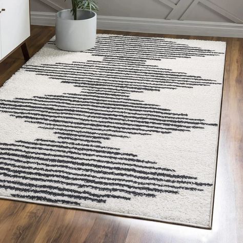 PRICES MAY VARY. PET-FRIENDLY AND DURABLE: Durable for high-traffic areas, soft and comfortable area rug perfect for families with kids; Low-pile synthetic rug fibers won’t trap dirt and debris, so they’re pet-friendly and easy to clean STAIN-RESISTANT AND NON-SHEDDING: This rug is made from synthetic fibers that are water resistant, stain resistant; It’s been machine-woven so the rug fibers will stay put; When properly cared for, this rug won’t shed fluff into your home EASY TO CARE FOR: Vacuum Synthetic Rugs, Stripe Rug Living Room, Ivory Color Scheme, Bohemian Contemporary, Area Rug White, Coastal Area Rugs, Contemporary Glam, Clean Bedroom, Rugs And Mats