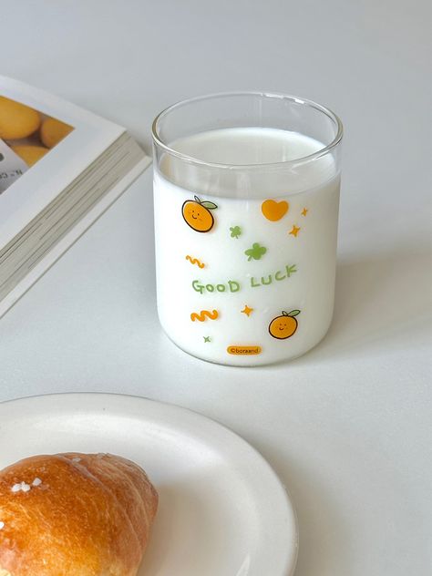 Editor's Notes Good Luck Glass Cup is a heat-resistant glass cup with a generous capacity and is made with a cute drawing print. This cup is perfect for any beverage, including hot beverages. - Heat-resistant glass cup- Good Luck design print- Generous capacity Measurements(in.)- 3 in.(dia.) x 3.9 in.(H) / 14.5oz. (430ml) Composition & Care- Glass- Wash with a soft sponge before use- Avoid strong impacts and sharp objects as there i Glass Cup Photography, Cute Glass Cups, Cups Aesthetic, Aesthetic Glass Cup, A Cute Drawing, Beautiful Kitchenware, Kawaii Cups, Kitchen Decor Collections, Kitchen Cups