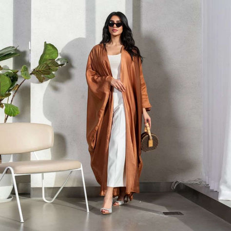 Shop the Satin Dubai Arab Cardigan Open Abaya Dress for a chic and versatile addition to your closet! Perfectly tailored to flatter all body types, it’s a must-have for modern women.