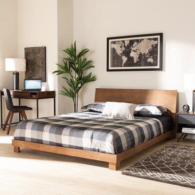 This low-profile platform bed delivers a streamlined aesthetic while opening up your space. It has a solid and engineered wood frame in a warm walnut finish and stands on low-to-the-ground block feet - making your ceilings appear higher than they are. It features a minimalist, rectangular panel headboard, showing off the natural wood grain color variation of the material. Clean-lined and simple, it complements nearly any modern or contemporary design scheme. This bed includes 13 support slats an Contemporary Platform Bed, King Size Platform Bed, Low Profile Platform Bed, Bed Color, Full Size Platform Bed, Queen Size Platform Bed, Full Platform Bed, Queen Platform Bed, Wood Bed Frame