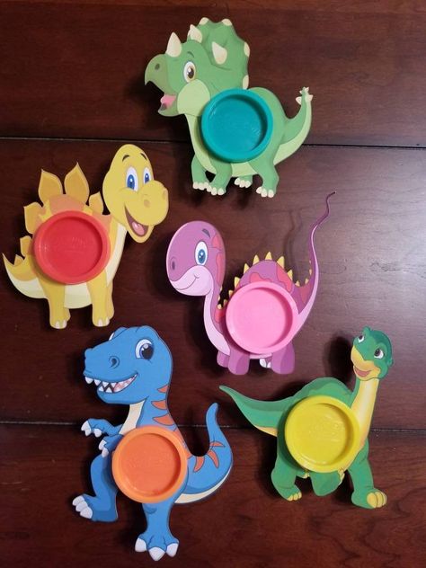 These cute Dinosaur Birthday Play-Doh Party Favors cards, make a great and different party favor. They also make great classroom gifts, or even just for a rainy day activity. Each bag includes the following and is good for one child: - personalized bag topper with child's name and age - 1 Dino Play-Doh cardstock holder - 1, 1 oz. Play-doh container PLAY-DOH COLORS WILL VARY PER BAG OR DINO CARD Please feel free to message me with any questions. WE CAN CUSTOMIZE YOUR PARTY BY CREATING DIFFERENT T Cute Dinosaur Birthday, Play Doh Party, Dinosaur Favors, Rainy Day Activity, Dinosaur Birthday Party Decorations, Dinosaur Play, Kids Party Favors, Dinosaur Party Favors, Dinosaur Themed Birthday Party