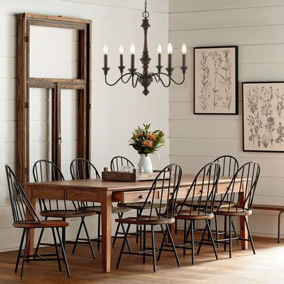 Based on historic wrought iron chandeliers, our rustic 6-light design features a quality wood-look finish. Perfectly sized for a farmhouse dining room, tall entry, or kitchen with high ceilings, our chandelier is just 25" wide and features tall candles with LED candle bulbs. Use this versatile chandelier in a modern farmhouse, French country or Tuscan style home, or to add character to a rustic, industrial space. | Canora Grey Oakley 25" 6-Light Midcentury Farmhouse Iron LED Chandelier, Wood Fin Midcentury Farmhouse, Table Finishes, Joanna Gaines House, Dining Wall Decor, Chandelier Wood, Farm House Dining Room, Farmhouse Dining Room Table, Farmhouse Dining Table, Farmhouse Dining Room